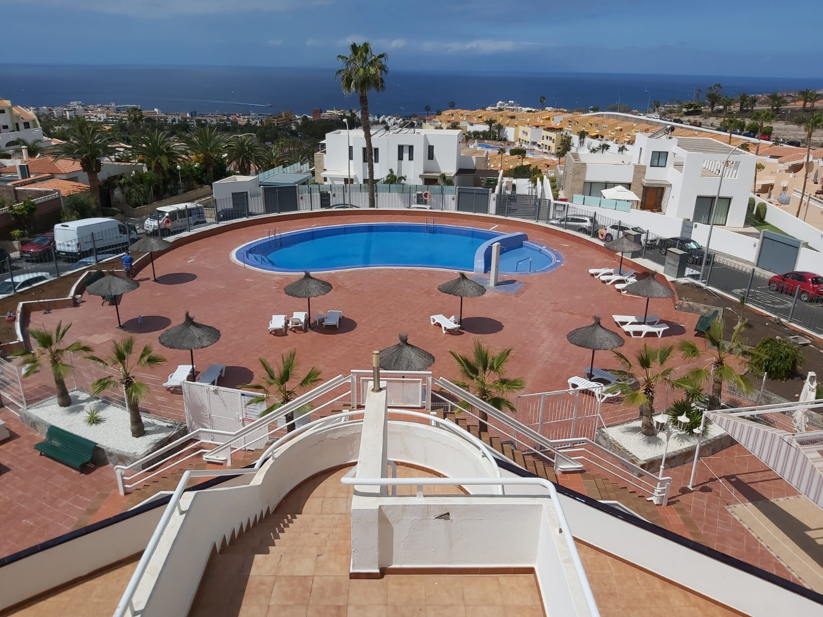 The complex pool with the ocean behind