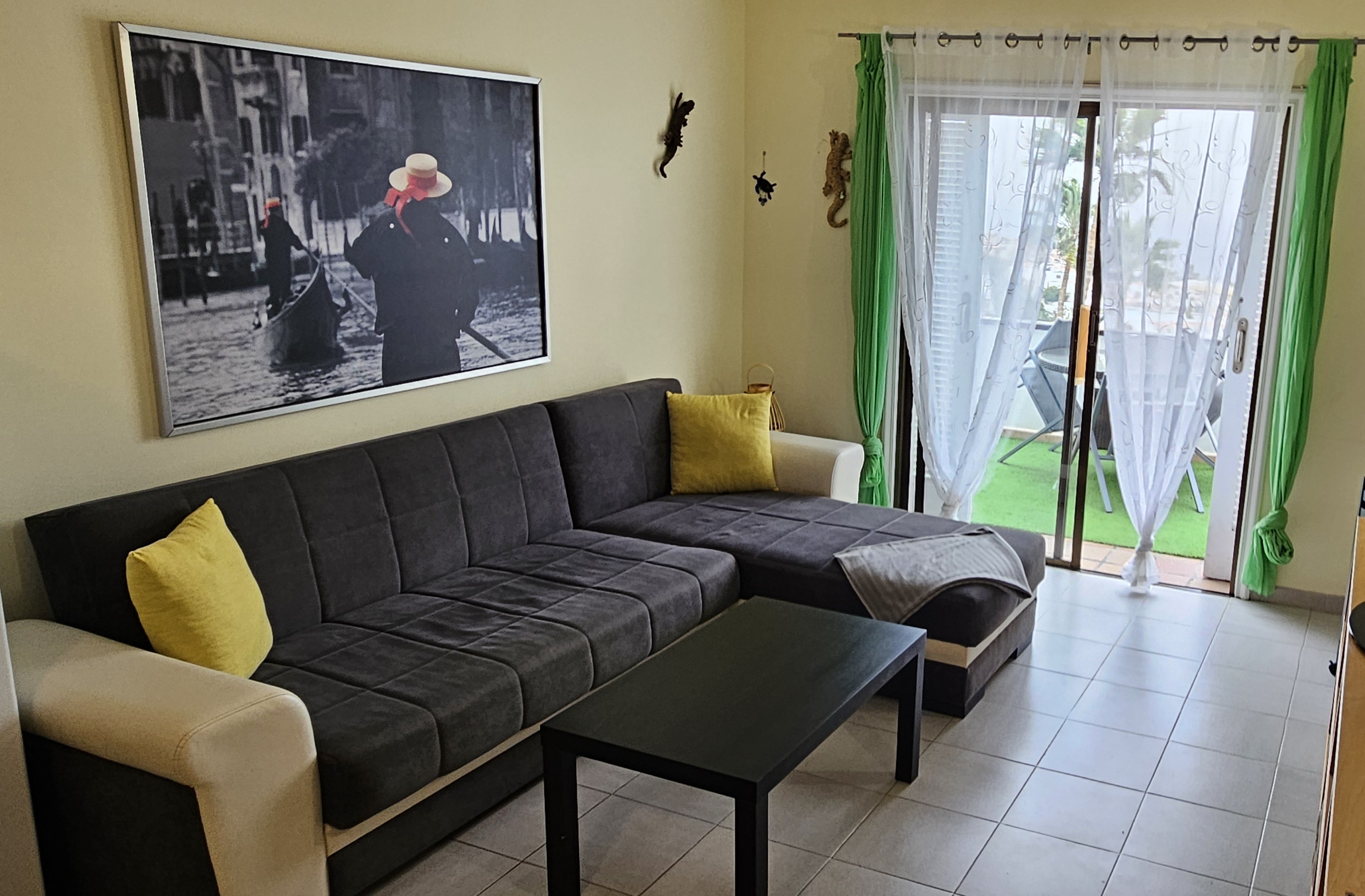 Living room with corner sofa and terrace door