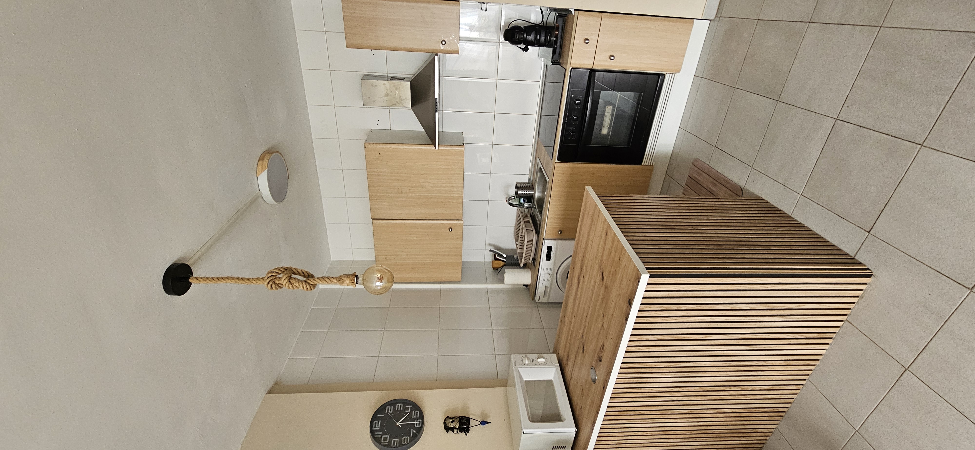 Kitchen with oven, microwave and fridge