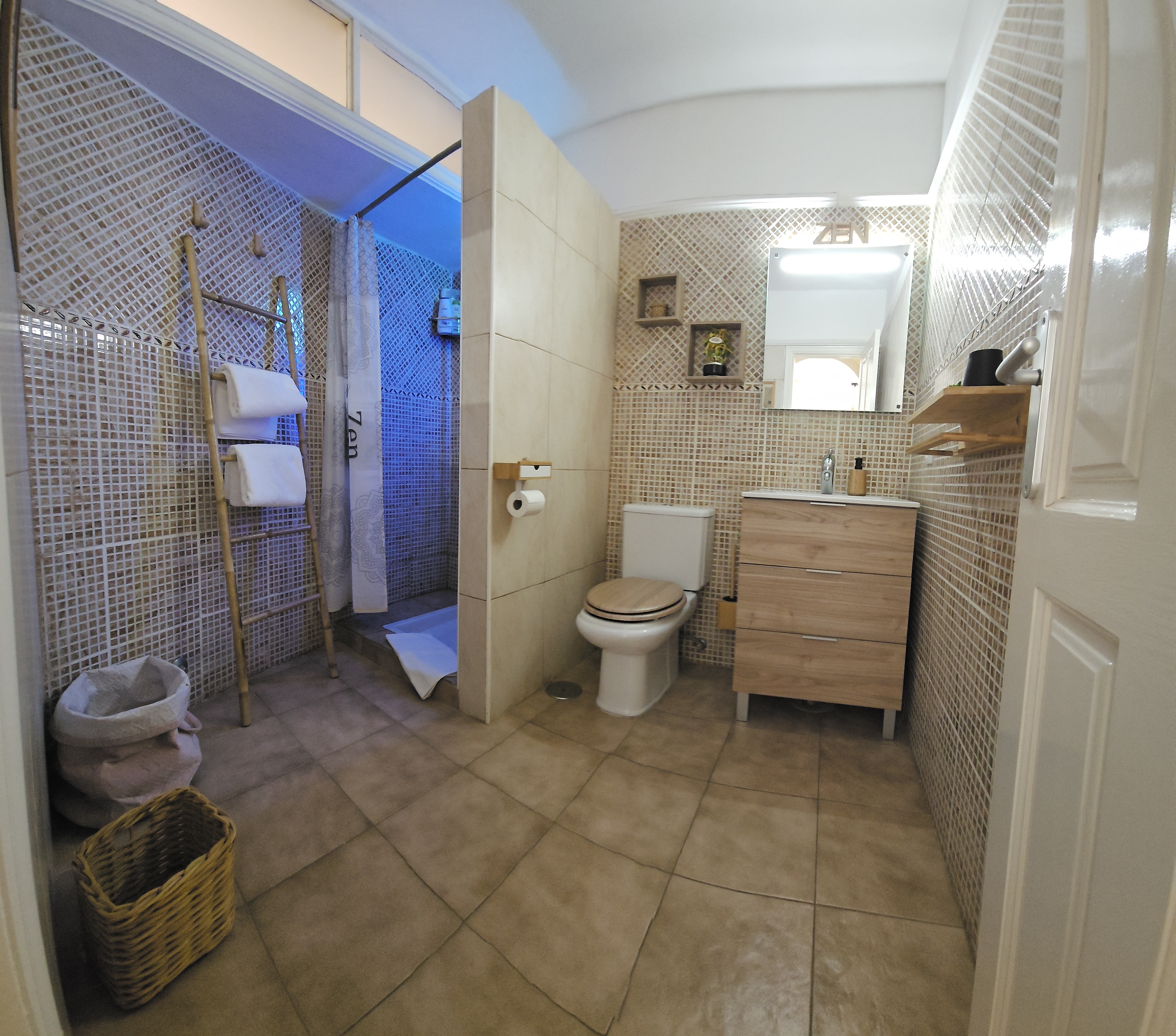 Bathroom with shower and washbasin