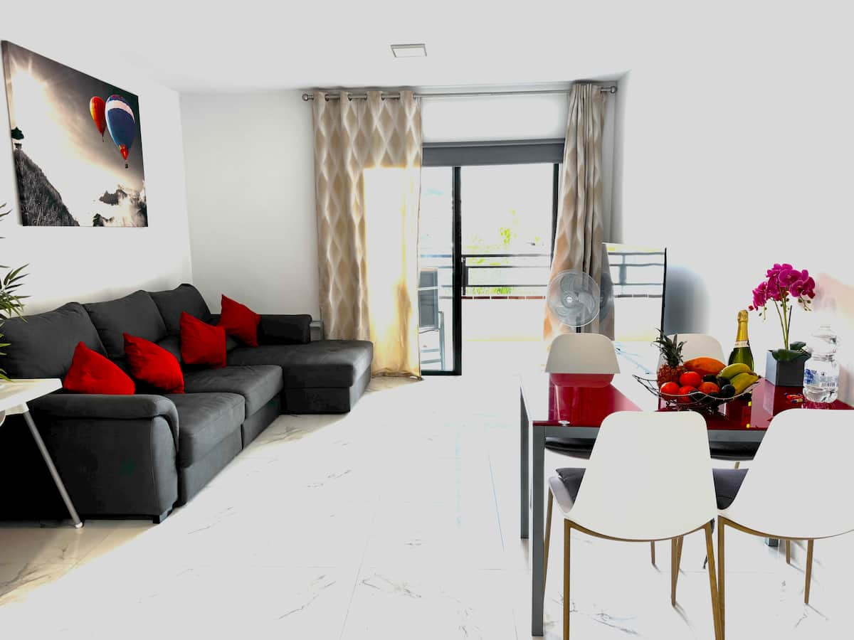 Living room with corner sofa and dining area