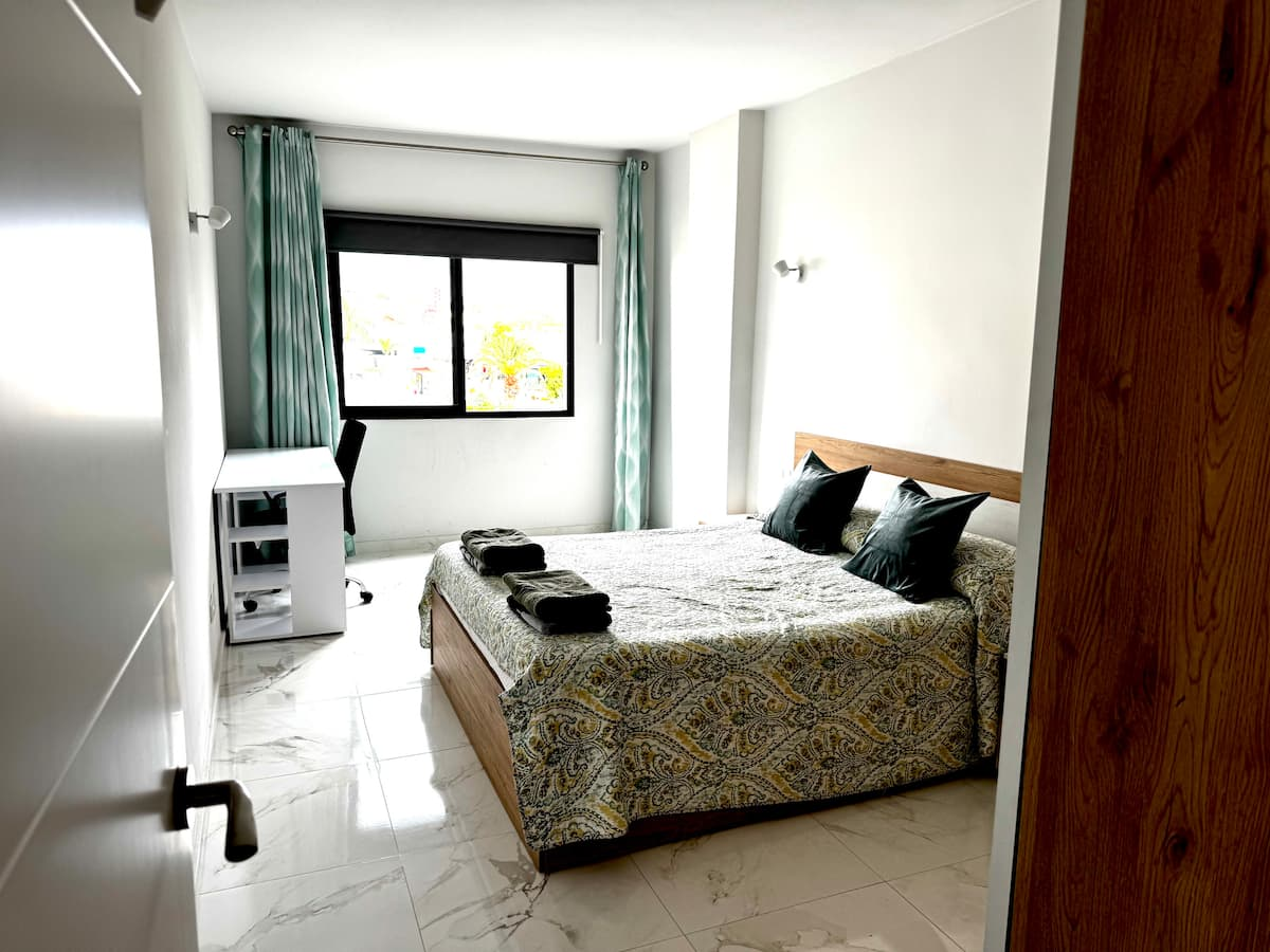 Bedroom with double bed and wardrobe