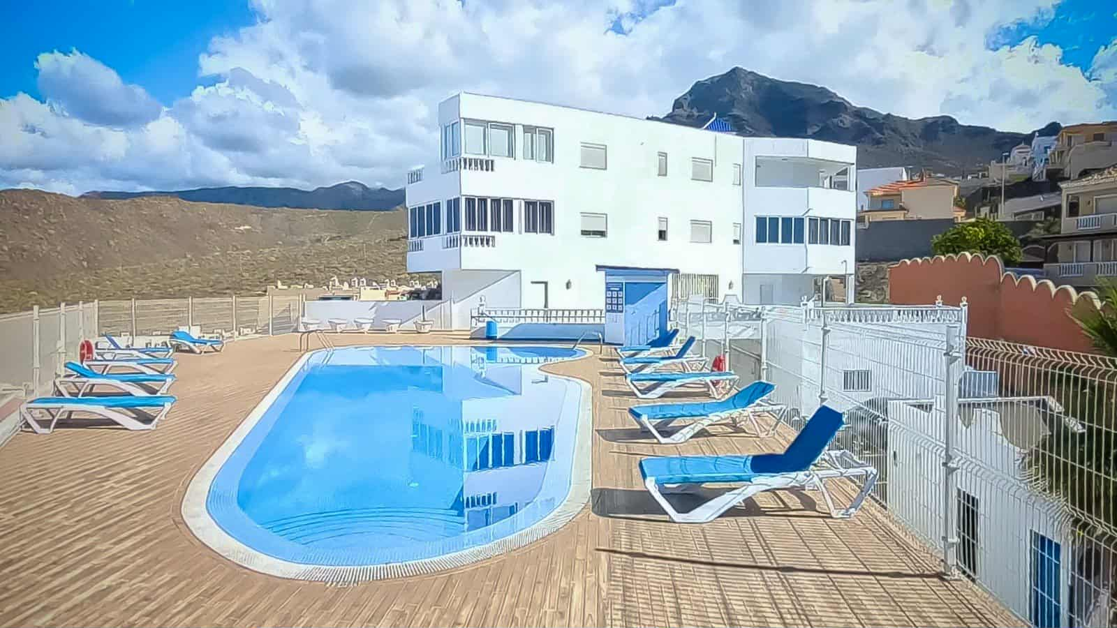 Rooftop pool with sun loungers